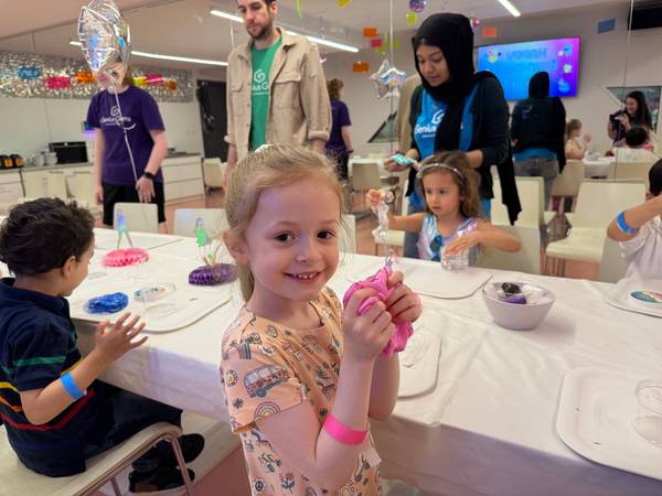 Kids making slime at the party table at Genius Gems NYC