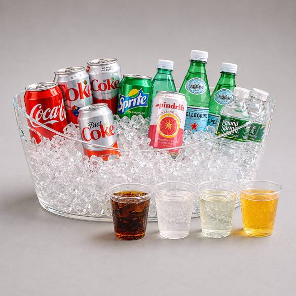 Clear tub of ice filled with soda cans and sparkling water bottles beside four cups of drinks