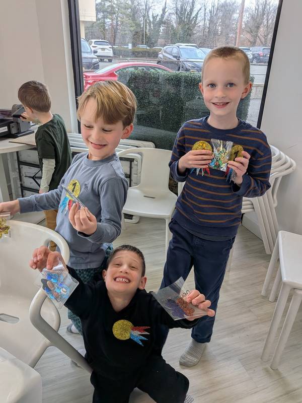 Kids showing off their goodie bags