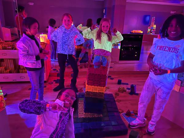 A glow-in-the-dark tile party under blacklight